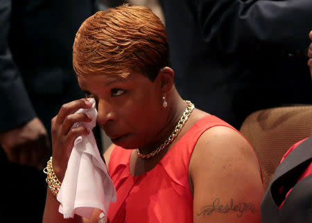 FILE PHOTO: Lesley McSpadden wipes away tears during the funeral services for her son Michael Brown at Friendly Temple Missionary Baptist Church in St. Louis, Missouri, U.S., August 25, 2014. REUTERS/Robert Cohen/Pool/File Photo