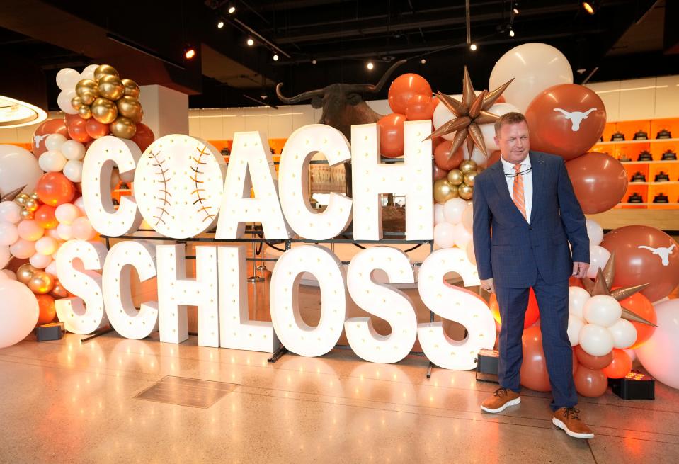 New Texas baseball coach Jim Schlossnagle poses for photos at his introductory press conference Wednesday at the Frank Denius Family University Hall of Fame. He's the 14th head coach in UT's storied baseball program and replaces David Pierce.