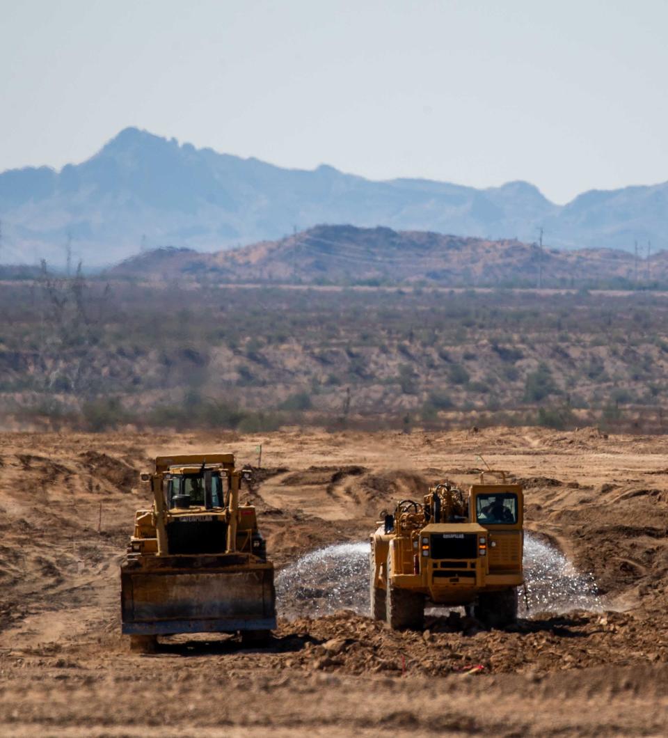 Construction vehicles at the construction site of Teravalis, a premier master planned community, in Buckeye on Oct. 5, 2023.