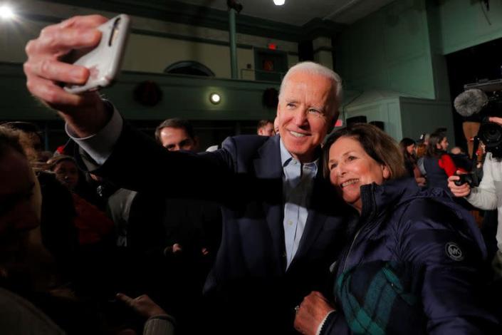 Democratic 2020 U.S. presidential candidate Biden takes a selfie with an audience member in Exeter