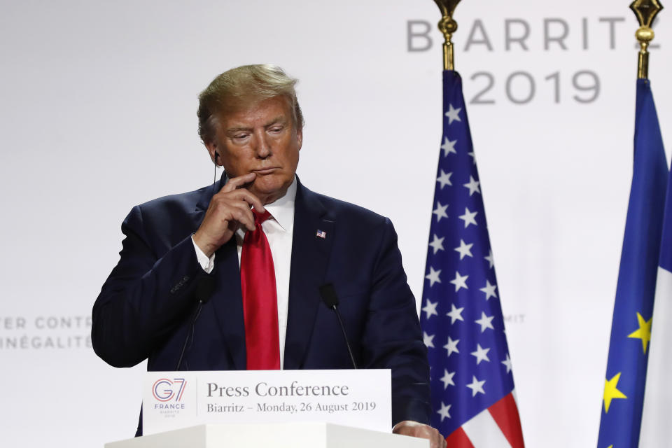 U.S President Donald Trump listens to French President Emmanuel Macron during the final press conference during the G7 summit Monday, Aug. 26, 2019 in Biarritz, southwestern France. (AP Photo/Francois Mori)