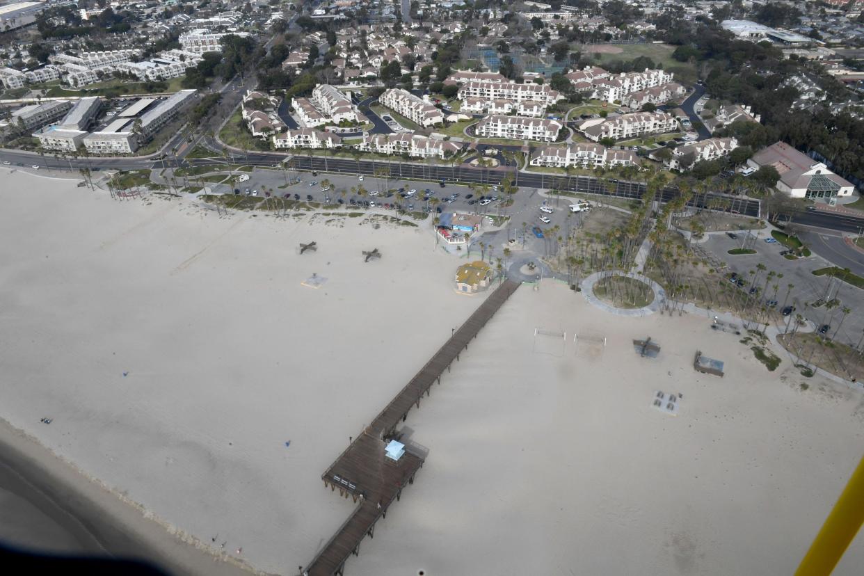 Homes along Surfside Drive in Port Hueneme edge up to Hueneme Beach Park and the pier as seen from a helicopter in December. City officials will lower speed limits along some streets, including Surfside Drive, and take other measure to rein in speeding motorists.