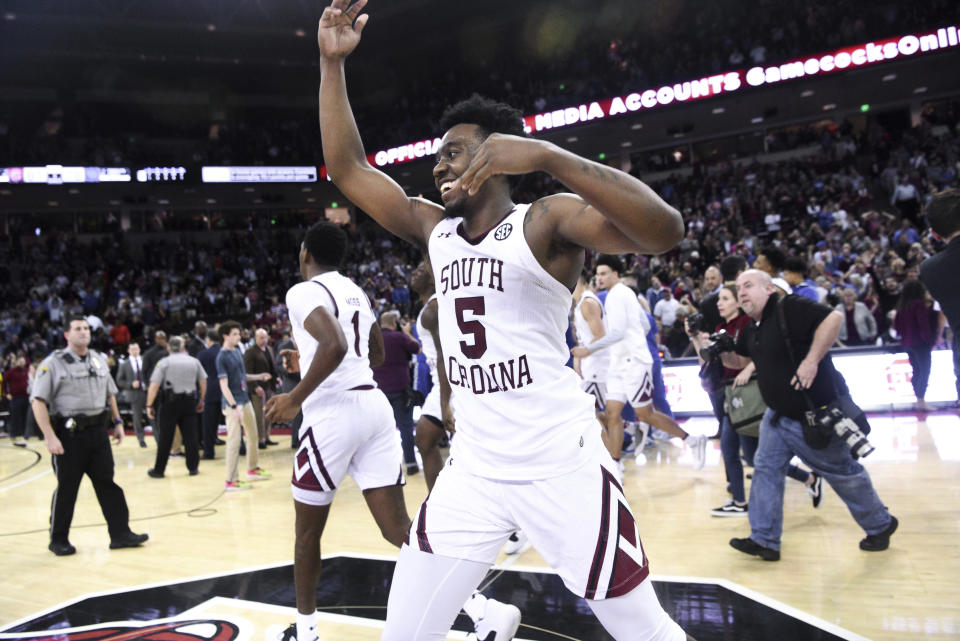 South Carolina guard Jermaine Couisnard (5) celebrates at the end of the team's NCAA college basketball game against Kentucky on Wednesday, Jan. 15, 2020, in Columbia, S.C. Couisnard hit the game-winning shot as South Carolina won 81-78. (AP Photo/Sean Rayford)