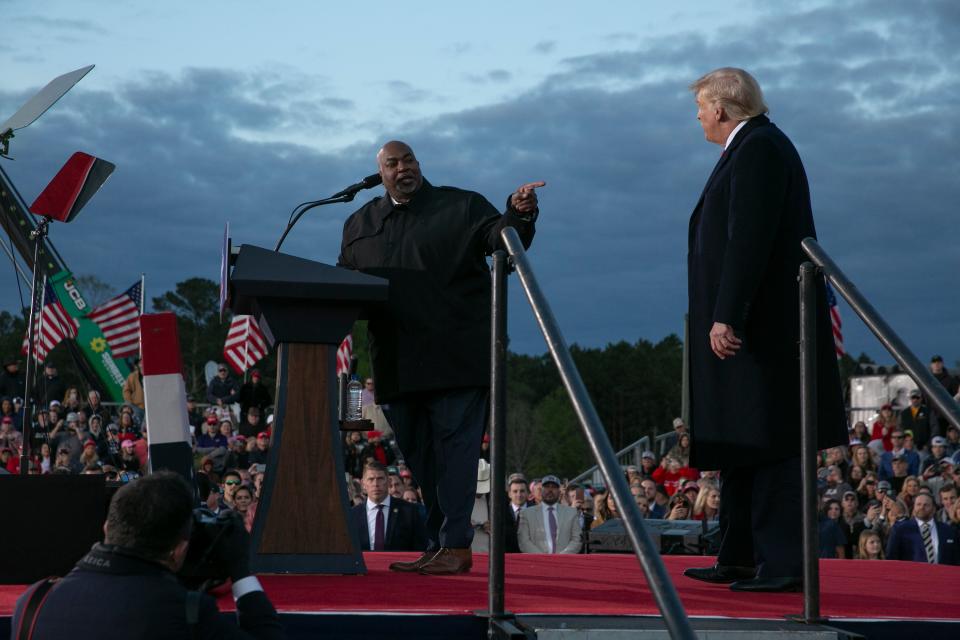 Trump and Robinson stand on stage together in 2022. Robinson will no longer appear at the former president’s rally on Saturday afternoon (Getty Images)