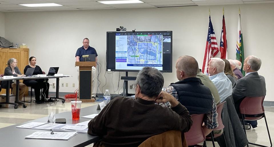 Licking County Planning Manager Brad Mercer explains Nov. 20 to the planning commission that The Shelly Co.'s proposed development activities in the Raccoon Creek floodplain would violate Federal Emergency Management Agency regulations.
