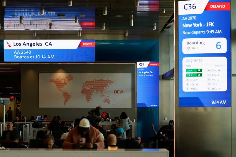 Screens display flight information in Dallas Fort Worth Airport