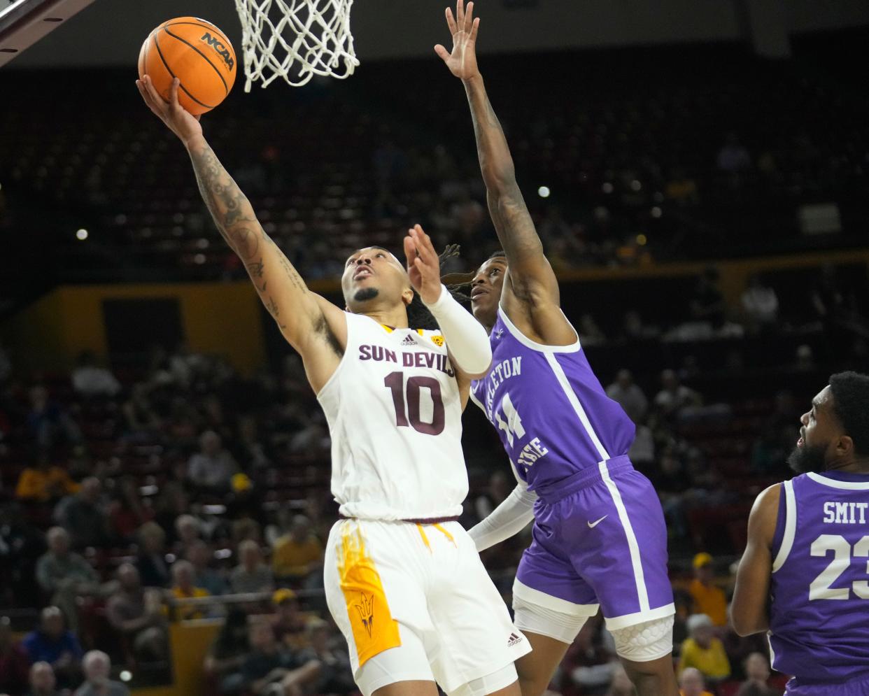 Nov 7, 2022; Tempe, Arizona, USA;  Arizona State guard Frankie Collins (10) lays the ball in against Tarleton State guard Javontae Hopkins (14) during the second half at Desert Financial Arena. Mandatory Credit: Michael Chow-Arizona Republic