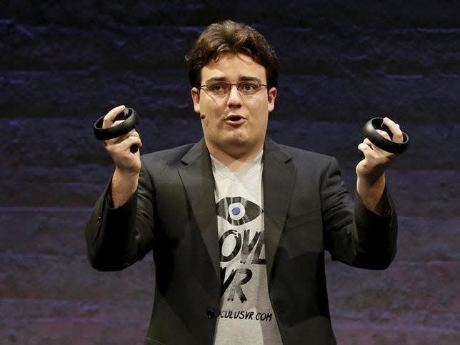 Oculus Founder Palmer Luckey displays an Oculus Touch input during an event in San Francisco, California June 11, 2015. REUTERS/Robert Galbraith