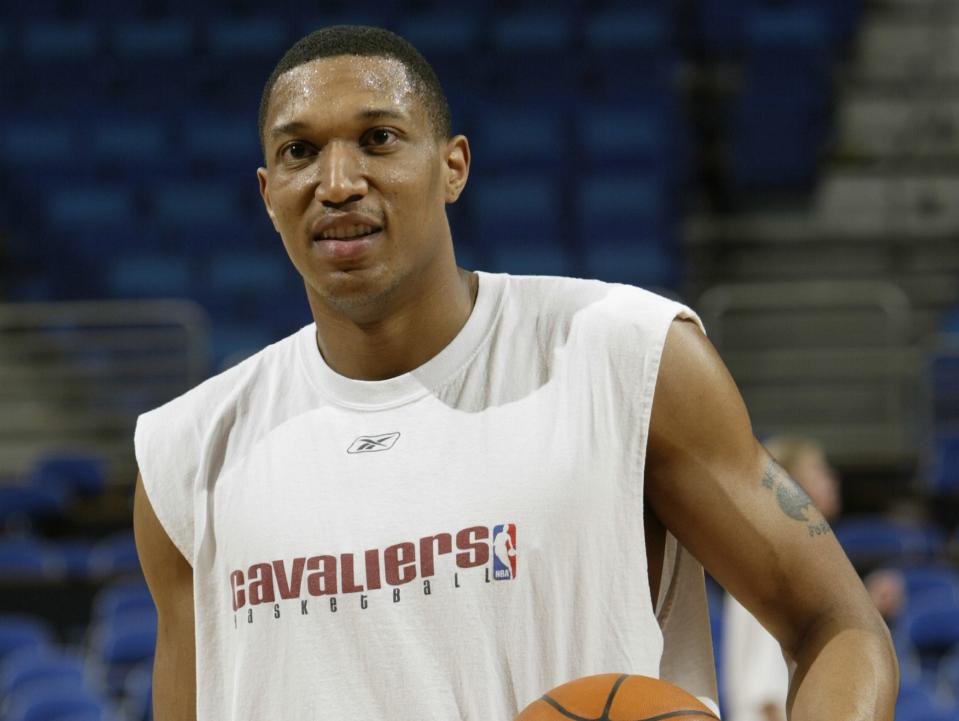 Tony Battie holds the ball and looks on during warmups in 2003.