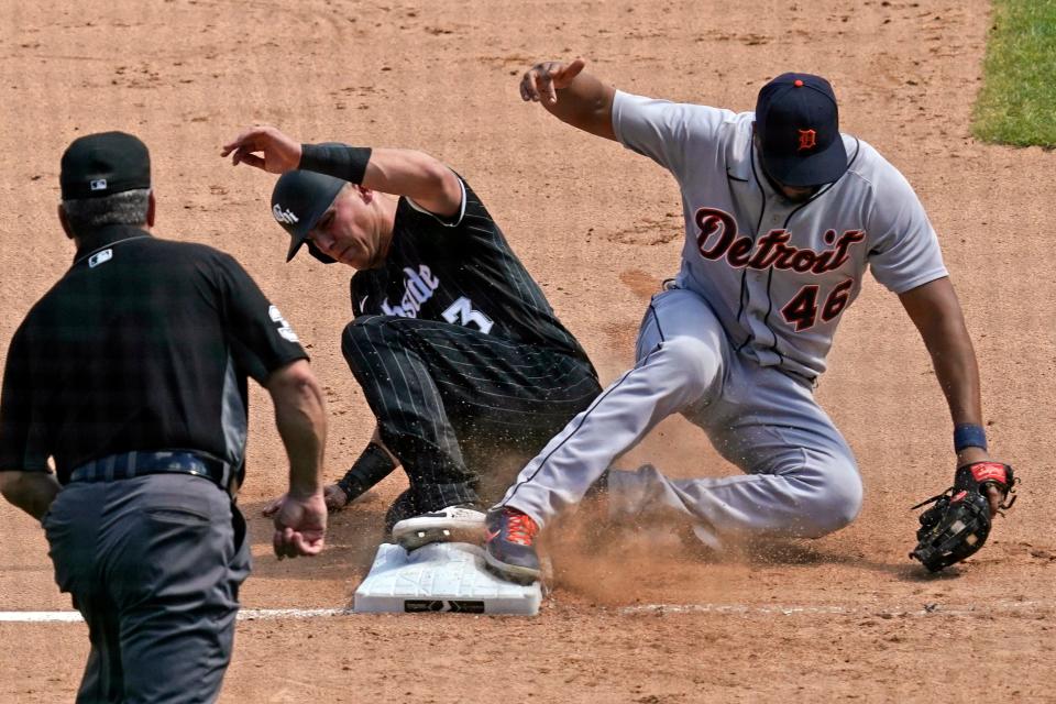 Detroit Tigers third baseman Jeimer Candelario, right, forces out Chicago White Sox's Jake Lamb at third during the sixth inning of a baseball game in Chicago, Saturday, June 5, 2021. (AP Photo/Nam Y. Huh)