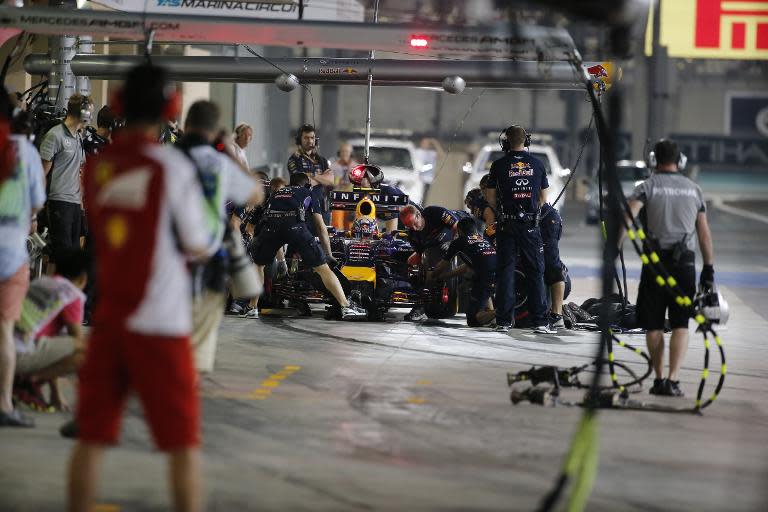 Red Bull Racing's Australian driver Daniel Ricciardo stops in the pits during the second practice session at the Yas Marina circuit in Abu Dhabi ahead of the Abu Dhabi Formula One Grand Prix on November 21, 2014