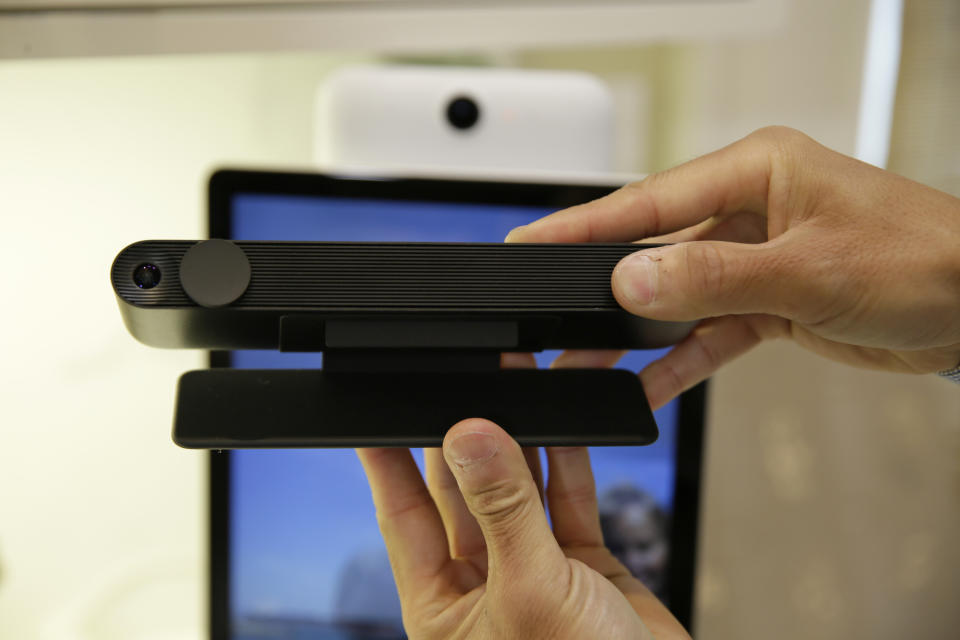 In this photo taken Tuesday, Sept. 17, 2019, product manager Bill Park demonstrates Facebook Portal TV during an event in San Francisco. Facebook is slashing the price and the size of the Portal, its screen and camera-equipped gadget for making video calls with friends and family as it attempts to get the device into more homes. (AP Photo/Eric Risberg)