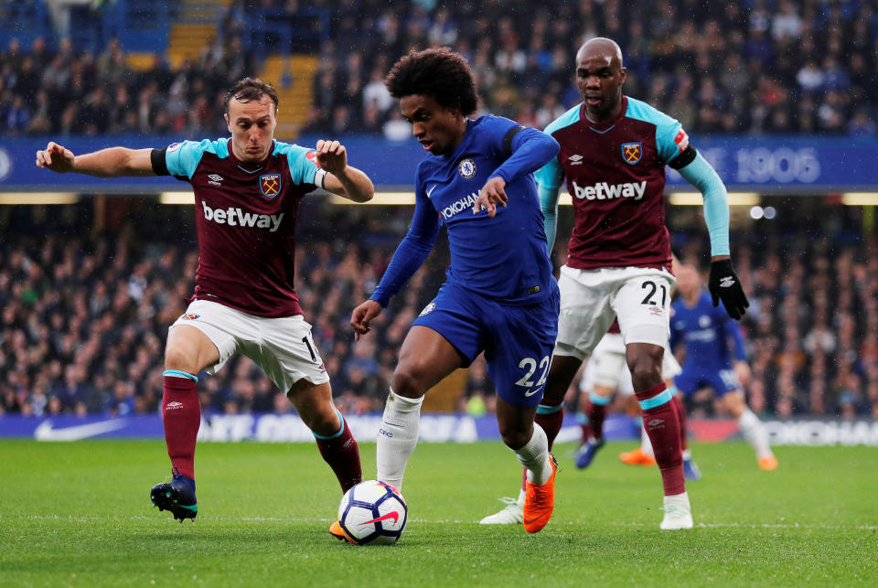 <p>Chelsea’s Willian is harried by Mark Noble (left) and Angelo Ogbonna </p>