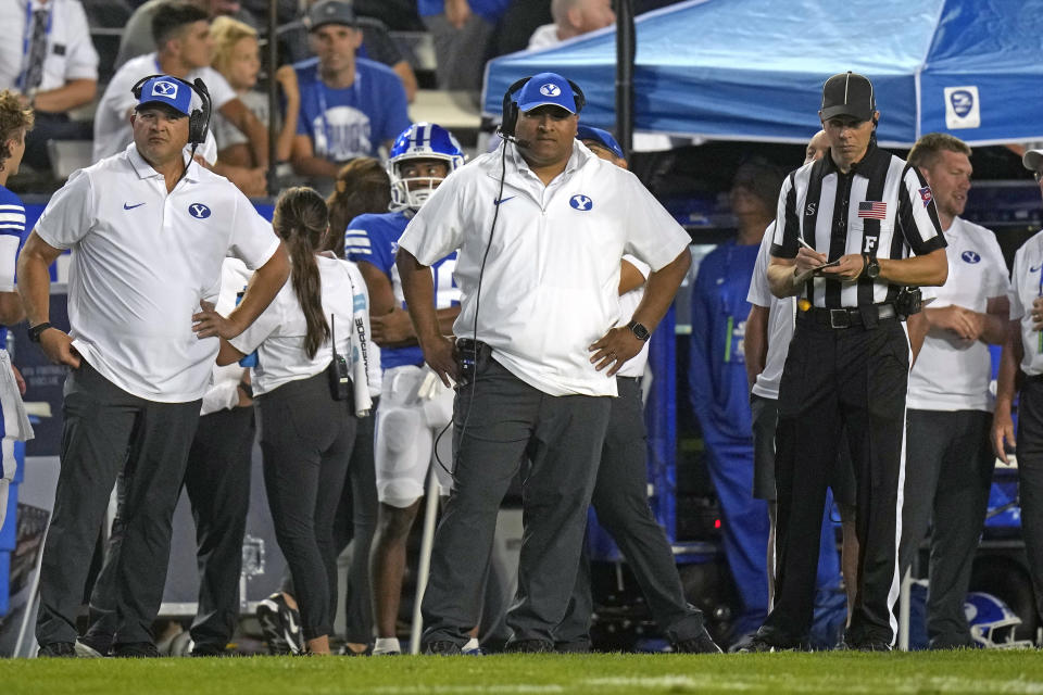 BYU coach Kalani Sitake, center, watches during the first half of the team's NCAA college football game against Sam Houston State on Saturday, Sept. 2, 2023, in Provo, Utah. (AP Photo/Rick Bowmer)