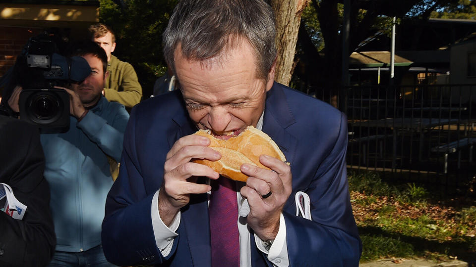 Bill Shorten was mocked for eating a sausage sizzle from the middle in 2016. Source: AAP