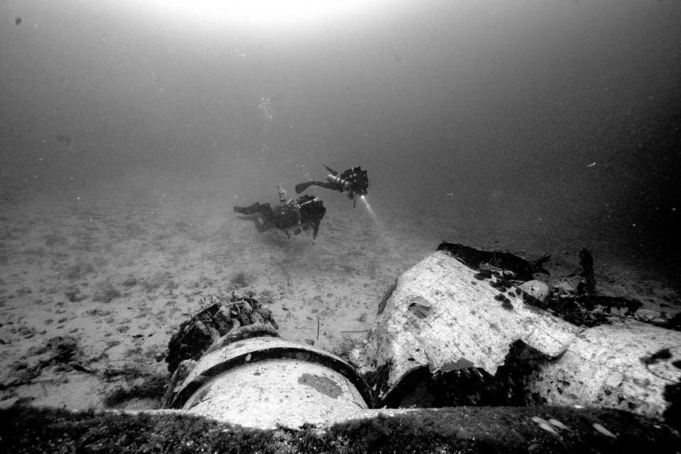 Divers near the B-24 Liberator wreck during excavations in 2018 to 2019.