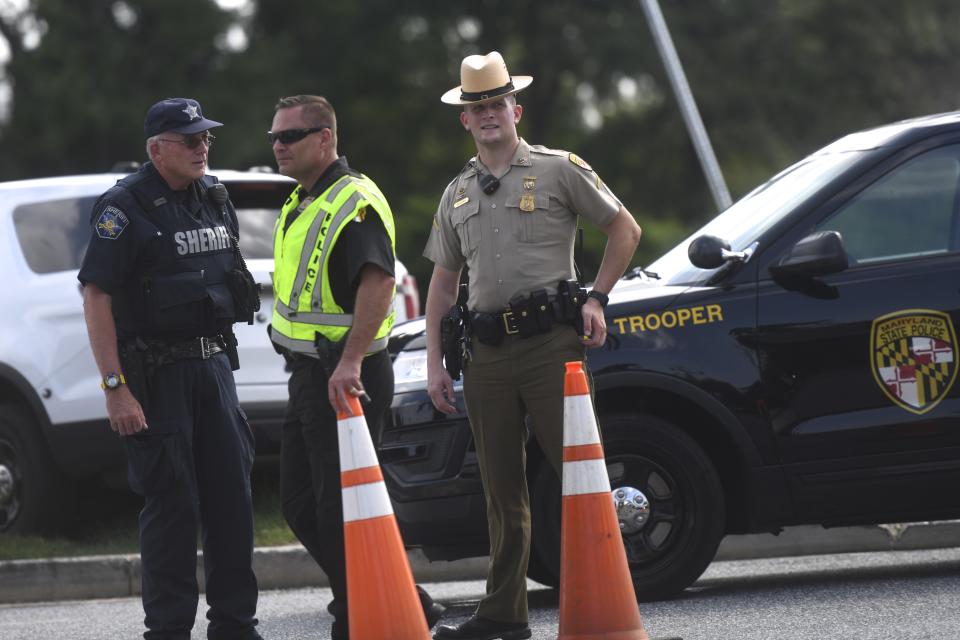 Maryland shooting: Officers patrol the scene where the woman opened fire at a Aberdeen Rite Aid warehouse. Source: Getty