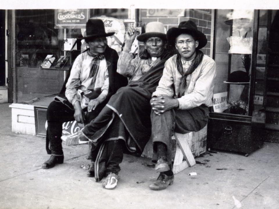 Portrait Of Three Osage Men Outside A Shop