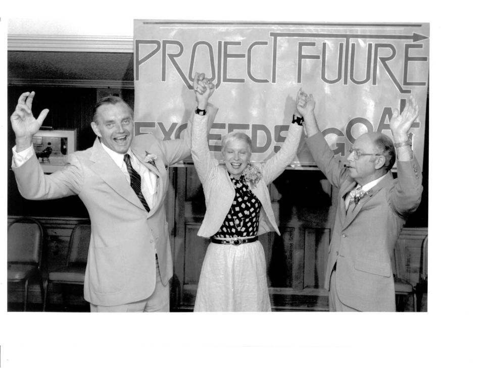 Fred P. Crowe, left, Ernestine M. Raclin and James W. Frick celebrate Project Future's success on Jan. 25, 1987, in this file photo. Raclin, a philanthropist and former chair of 1st Source Bank and 1st Source Corporation, died July 13, 2023, at the age of 95.