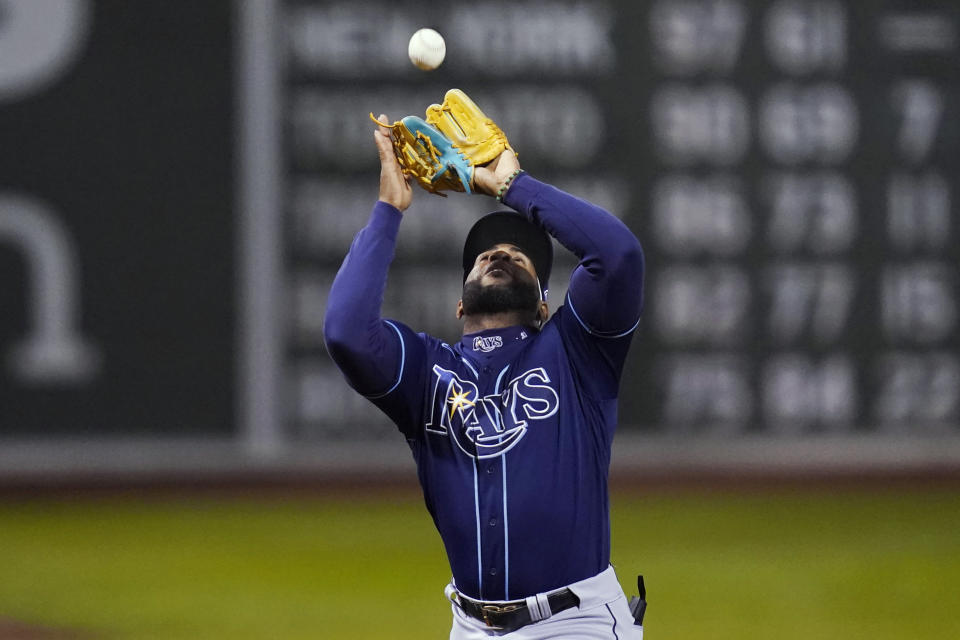 Tampa Bay Rays third baseman Yandy Diaz makes the catch on a fly ball by Boston Red Sox's Enrique Hernandez during the second inning of a baseball game Tuesday, Oct. 4, 2022, at Fenway Park, in Boston. (AP Photo/Charles Krupa)