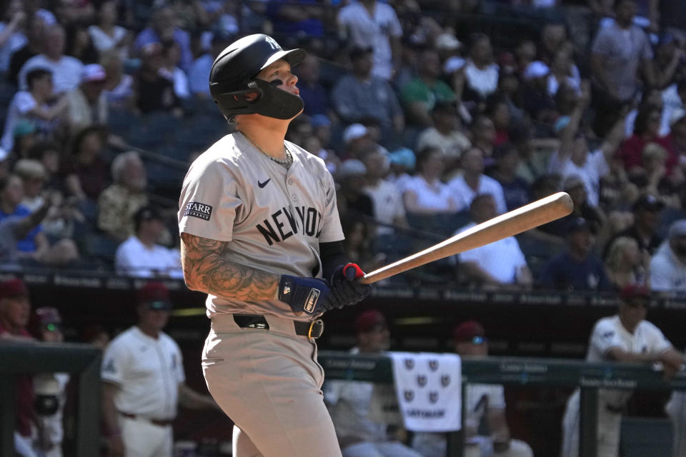 New York Yankees' Alex Verdugo hits a two run home run against the Arizona Diamondbacks in the tenth inning during a baseball game, Wednesday, April 3, 2024, in Phoenix. (AP Photo/Rick Scuteri)