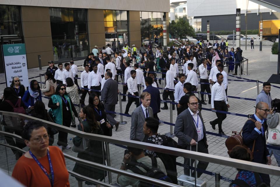Delegates arrive for the day at the COP28 U.N. Climate Summit, Sunday, Dec. 3, 2023, in Dubai, United Arab Emirates. (AP Photo/Rafiq Maqbool)