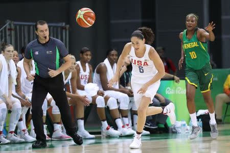 Aug 7, 2016; Rio de Janeiro, Brazil; United States forward/guard Angel McCoughtry (8) chases a loose ball in front of Senegal power forward Astou Traore (10) during the Rio 2016 Summer Olympic Games at Youth Arena. Mandatory Credit: Geoff Burke-USA TODAY Sports