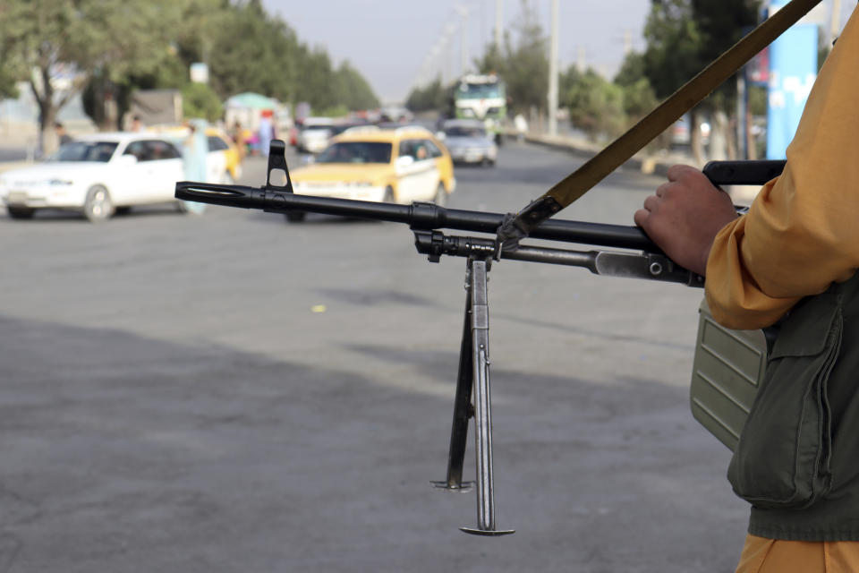 Taliban fighters stand guard in front of the Hamid Karzai International Airport after the U.S. withdrawal in Kabul, Afghanistan, Tuesday, Aug. 31, 2021. The Taliban were in full control of Kabul's international airport on Tuesday, after the last U.S. plane left its runway, marking the end of America's longest war. (AP Photo/Khwaja Tawfiq Sediqi)