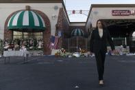 Vice President Kamala Harris walks toward the media after laying flowers at a memorial set up outside Star Dance Studio in Monterey Park, Calif., Wednesday, Jan. 25, 2023, to honor the victims killed in last week's mass shooting. (AP Photo/Jae C. Hong)