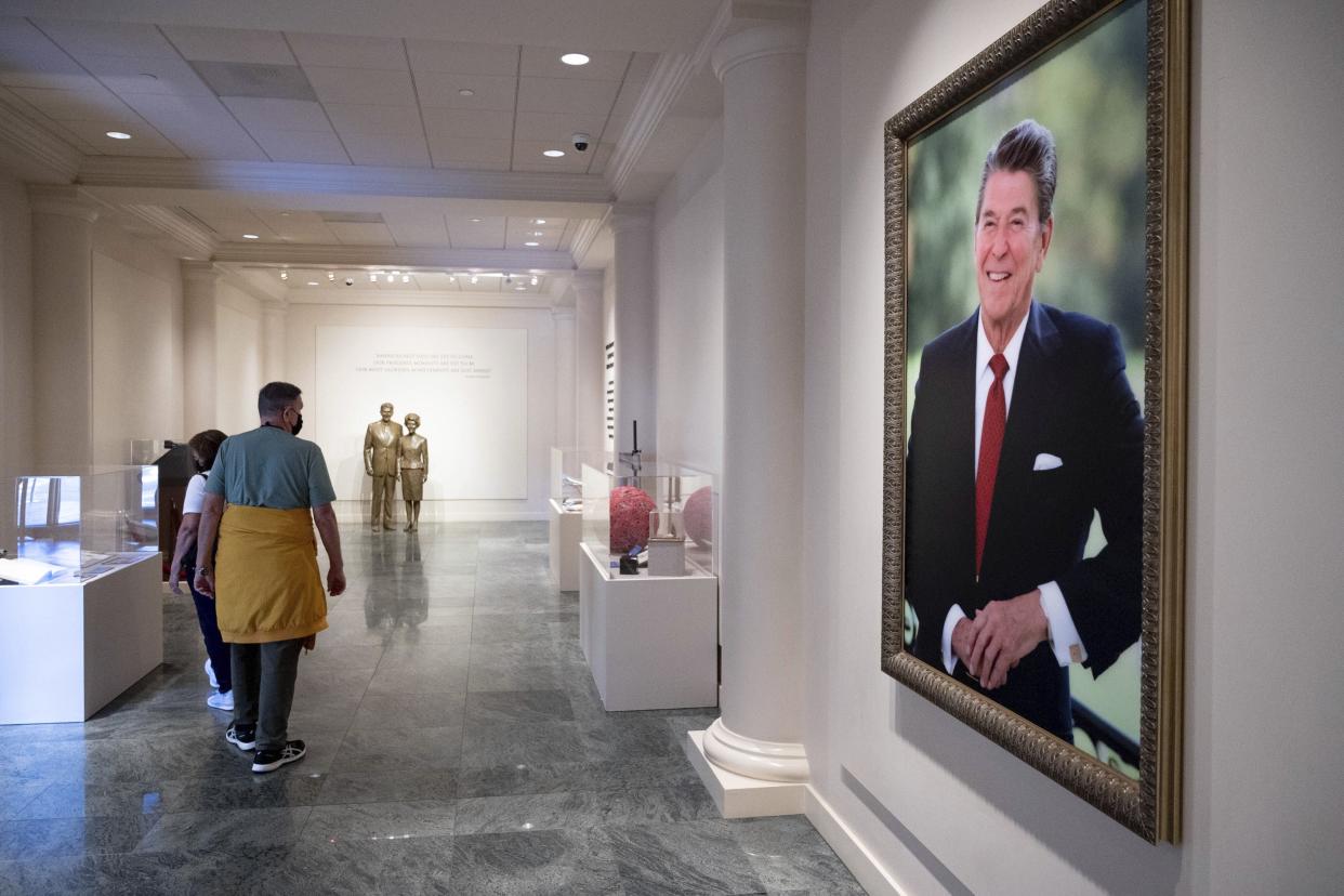 Visitors walk inside an exhibition at the Ronald Reagan Presidential Library and Museum Wednesday, Nov. 3, 2021, in Simi Valley, Calif. [David Crane/The Orange County Register/SCNG via AP]