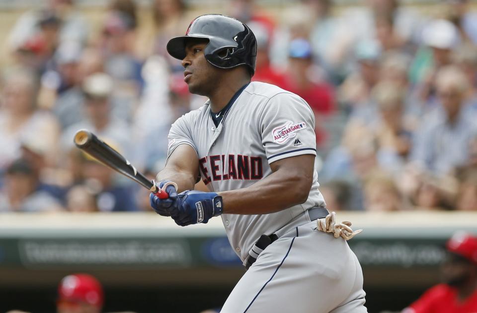 Cleveland Indians' Yasiel Puig hits an RBI double off Minnesota Twins pitcher Jose Berrios in the first inning of a baseball game Sunday, Aug. 11, 2019, in Minneapolis. (AP Photo/Jim Mone)