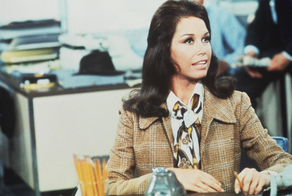 American actress and commediene Mary Tyler Moore (as Mary Richards) sits at a desk in a scene from 'The Mary Tyler Moore Show' (also known as 'Mary Tyler Moore'), Los Angeles, California, 1970. (Photo by CBS Photo Archive/Getty Images) 