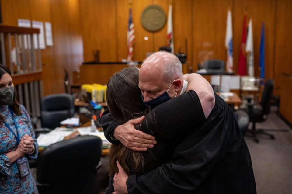 Judge Lawrence Brown embraces Shanie Phillips who graduates Mental Health Court on Tuesday, Jan. 25, 2022, in Brown’s courtroom at Sacramento Superior Court. “You’re just a perfect example of what can occur when everything sort of comes together,” Brown said.