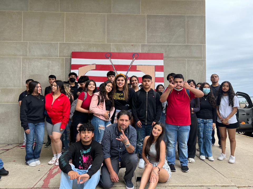 East High School AP Spanish and Spanish Heritage classes, taught by Ruby Herrera, celebrated the completion of their El Chapulín Colorado mural on May 20, 2022.

El Chapulín Colorado is an iconic Mexican superhero that represents Latino culture, hope, and resilience. Des Moines artist Seso Marentes designed the mural and helped the students paint it.