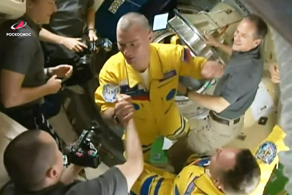 From video footage released by the Roscosmos Space Agency, newly arrived to the ISS, Russian cosmonauts Denis atveev, centre, and Sergei Korsakov, right, bottom say hello to other participants of expedition to the International Space Station, ISS, after docking the Soyuz MS-21 space ship to the station International Space Station - 18 Mar 2022