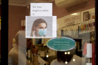 A pharmacy in Rome advertises the sale of face masks Wednesday, Jan 29, 2020. Although no case of the new virus has been reported so far in Italy, many pharmacies are reportedly running out of hygienic masks due to the fear of contagion. (AP Photo/Gregorio Borgia)