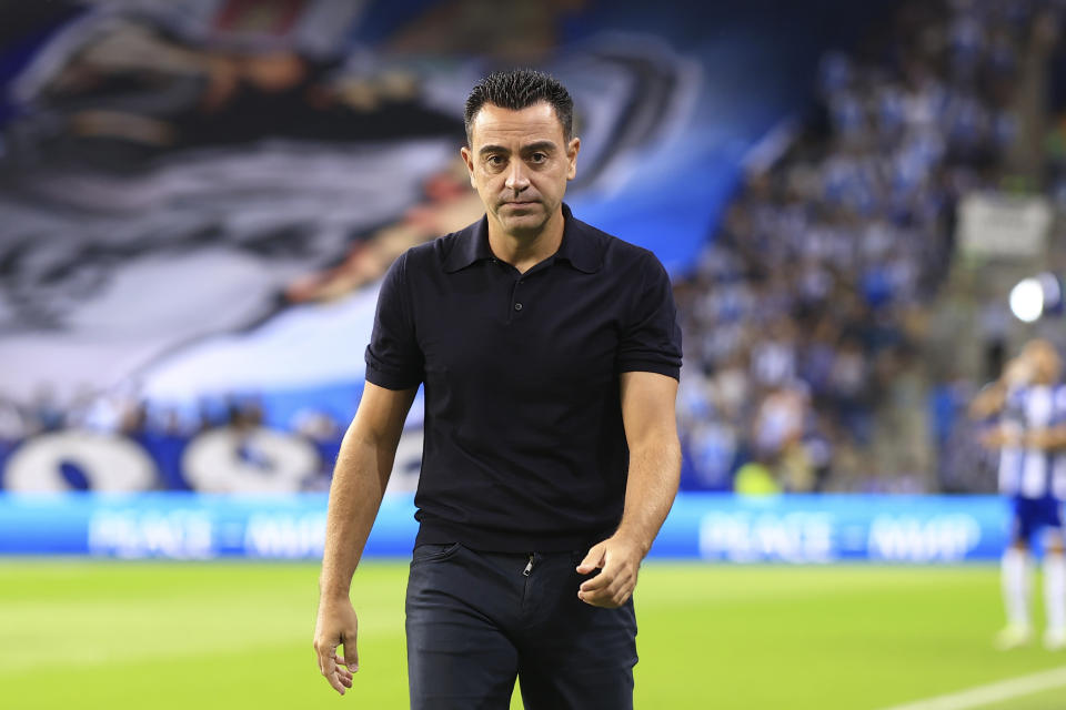 Barcelona's head coach Xavi Hernandez walks to the bench before a Champions League group H soccer match between FC Porto and Barcelona at the Dragao stadium in Porto, Portugal, Wednesday, Oct. 4, 2023. (AP Photo/Luis Vieira)