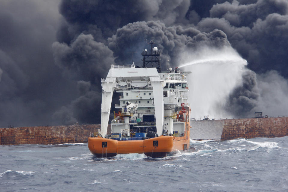 <p>A rescue ship works to extinguish the fire on the burning Iranian oil tanker Sanchi in the East China Sea, in this Jan. 12, 2018 picture provided by Shanghai Maritime Search and Rescue Centre and released by China Daily. (Photo: China Daily via Reuters) </p>