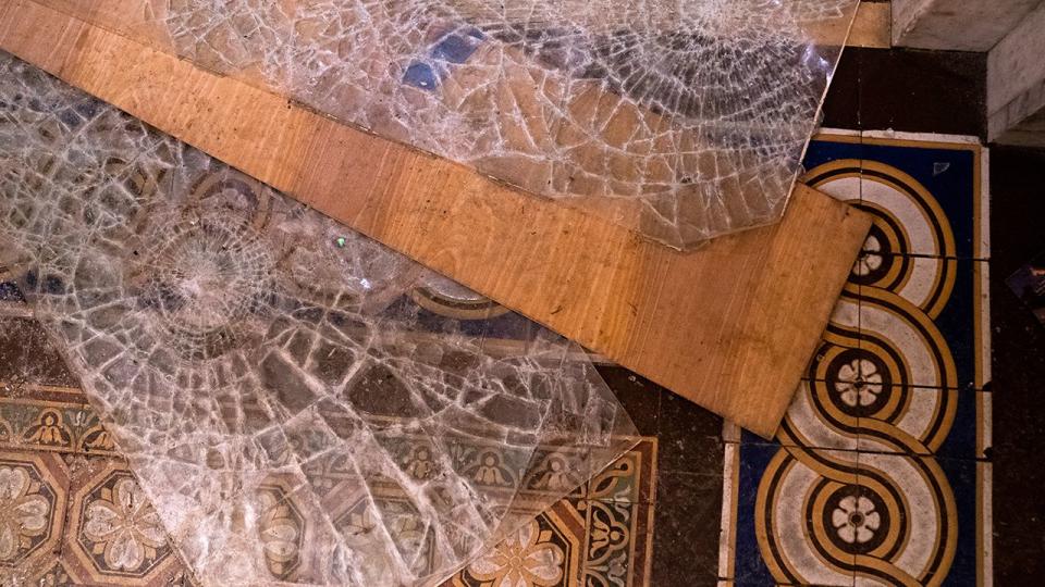 Broken glass lay on the floor inside the U.S. Capitol in Washington D.C., U.S., on Wednesday, Jan. 6, 2021. The House and Senate resumed a politically charged debate over the legitimacy of the presidential election hours after a pro-Trump mob stormed the U.S. Capitol and drove lawmakers from their chambers.