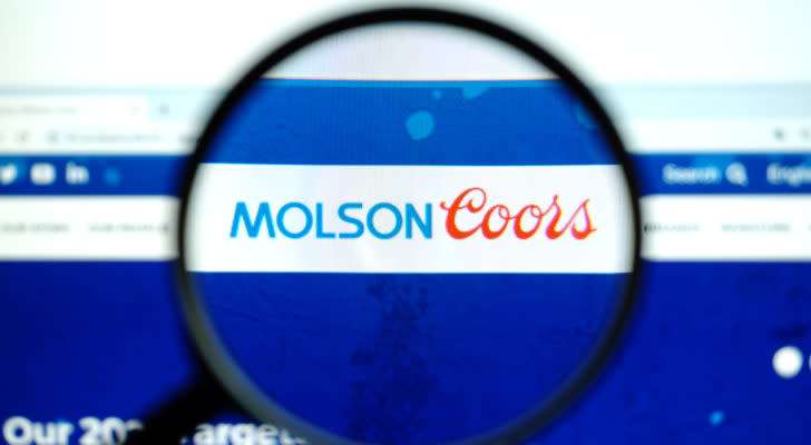 Molson Coors (TAP) logo on a web browser magnified by a magnifying glass