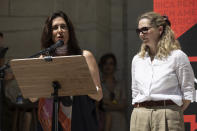 American biographer Amanda Foreman, right, and American journalist Andrea Elliot, left, speak during a reading event in solidarity with Salman Rushdie outside the New York Public Library, Friday, Aug. 19, 2022, in New York. (AP Photo/Yuki Iwamura)