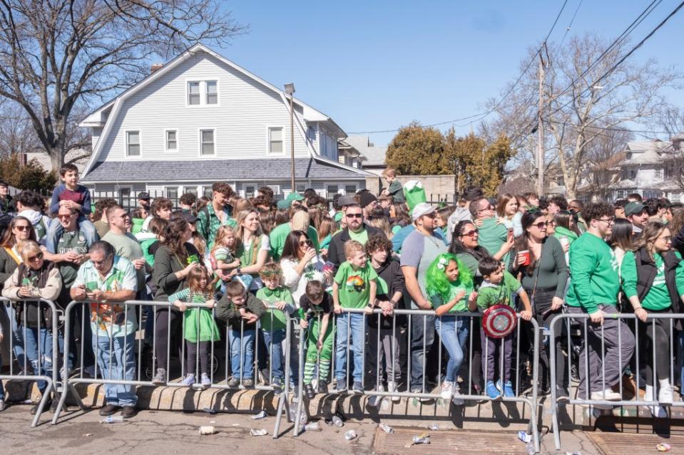 Families decked out in green lined the streets of Forest Avenue Sunday as they cheered for the marchers. LP Media