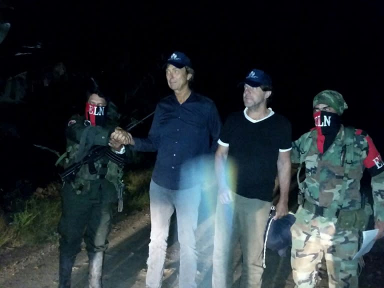 Dutch journalists Derk Johannes Bolt and Eugenio Ernest Marie Follender are pictured in this handout photo from the Colombian Ombudsman press office following their release by the country's ELN rebels