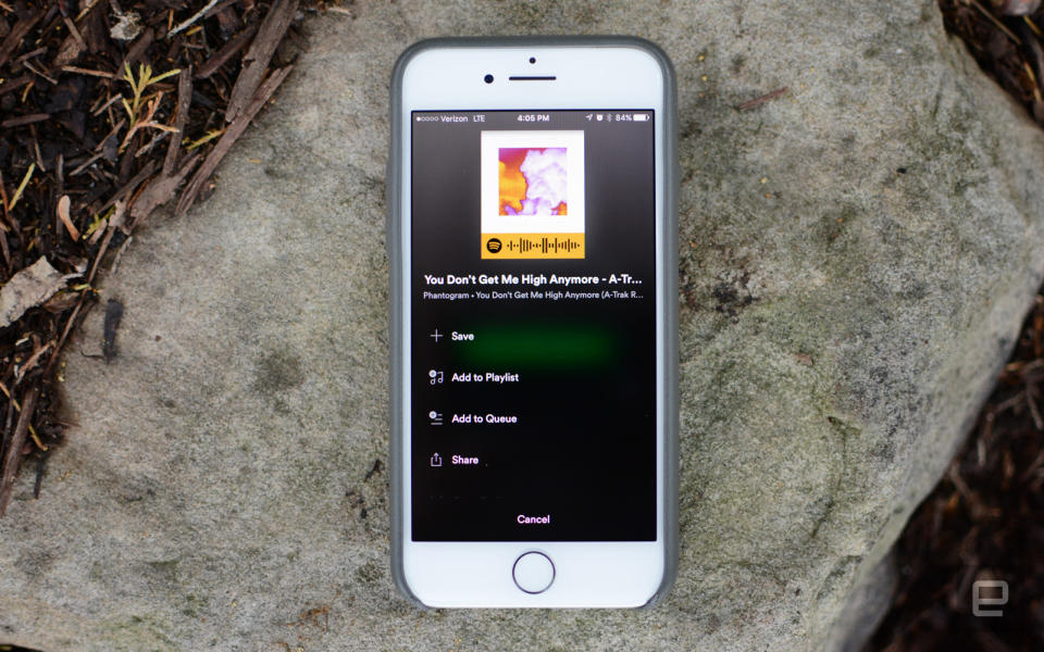 Photo of an iPhone showing a Spotify code for a song.