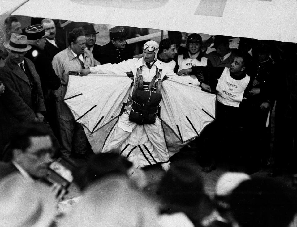 Clem Sohn is shown before entering the airplane for his exhibition parachute jump in Paris, France. April 25, 1937. The American "Bird Man" leaped from an airplane at a height of 10,000 feet when his first parachute failed to open, crashing to the ground before his second parachute had time to open.