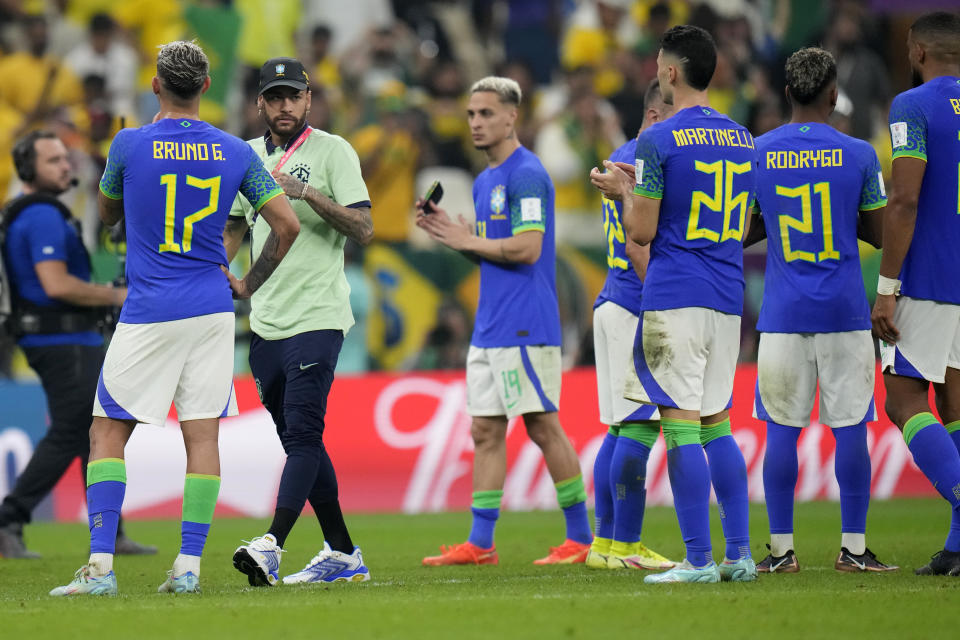 Brazil's Neymar, second left, and his teammates after the World Cup group G soccer match between Cameroon and Brazil, at the Lusail Stadium in Lusail, Qatar, Saturday, Dec. 3, 2022. (AP Photo/Moises Castillo)