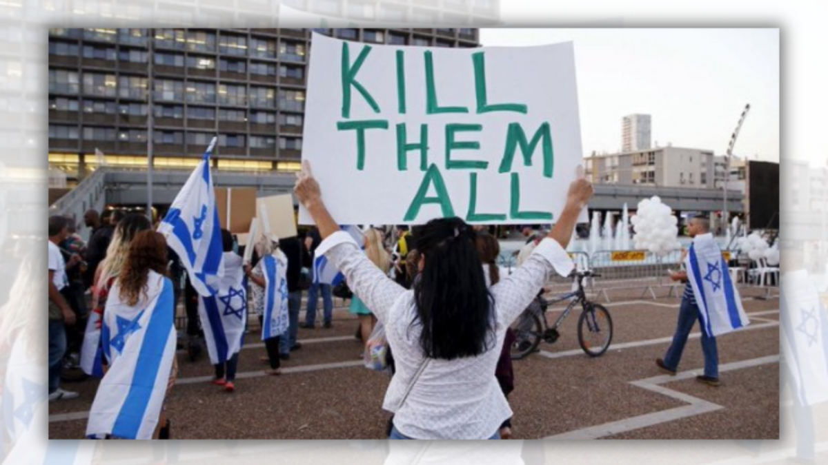 A person in a white shirt stands in front of a building while holding a sign that says, "KILL THEM ALL." Surrounding the sign-holder are several people, some of which are holding or wearing Israeli flags. 