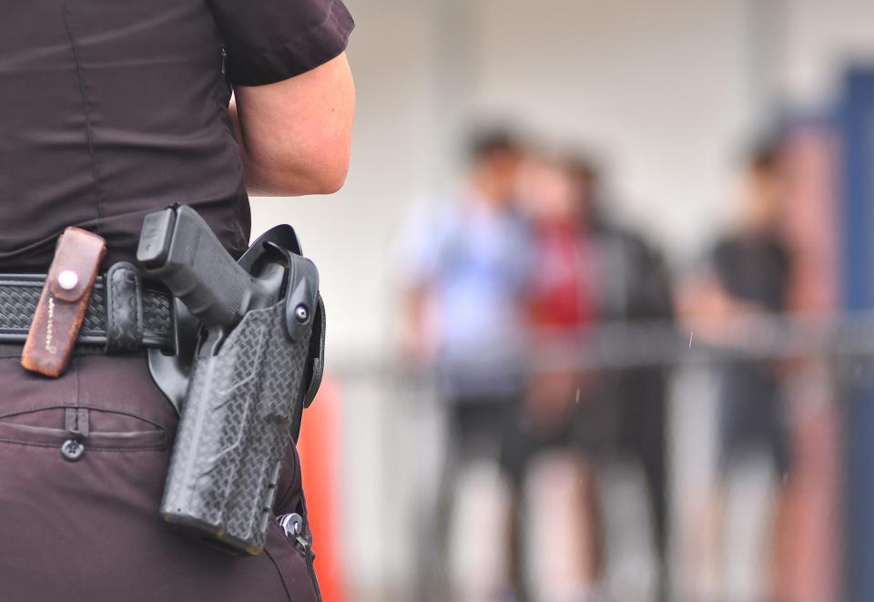 A Melbourne police school resource officer on duty at a Melbourne school in 2018.