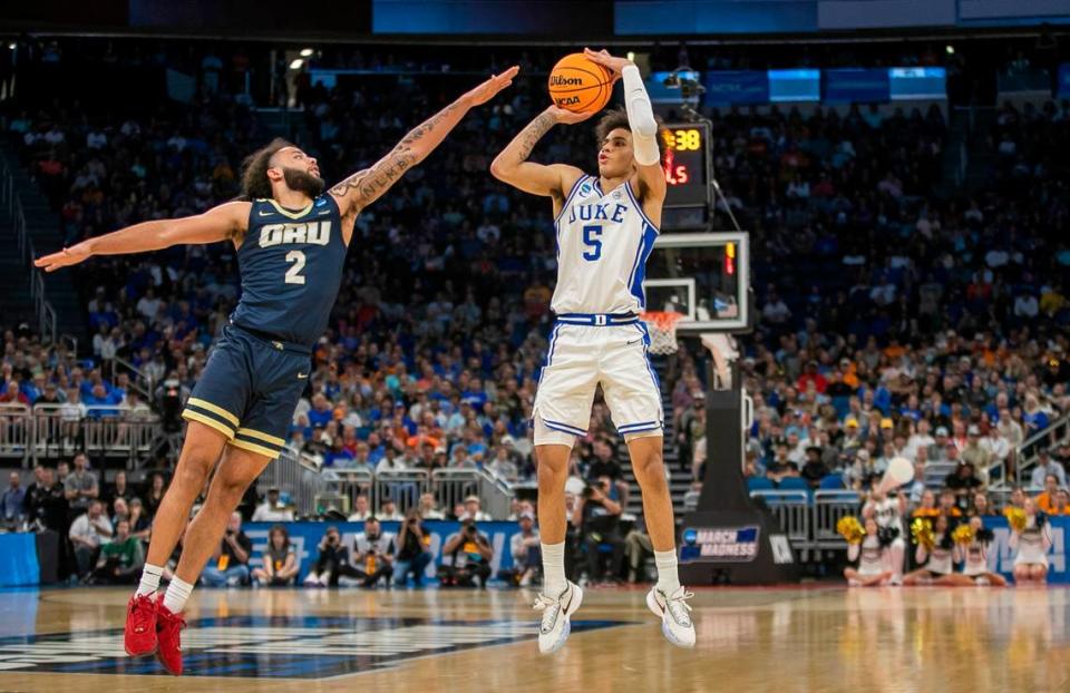 Duke’s Tyrese Proctor (5) launches a three point shot over Oral Roberts’ Kareem Thompson (2) in the second half during the first round of the NCAA Tournament on Thursday, March 16, 2023 at the Amway Center in Orlando, Fla.