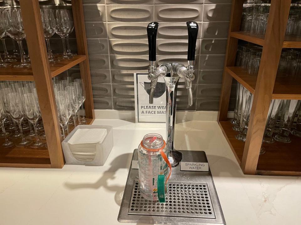 A water station in the airport lounge.